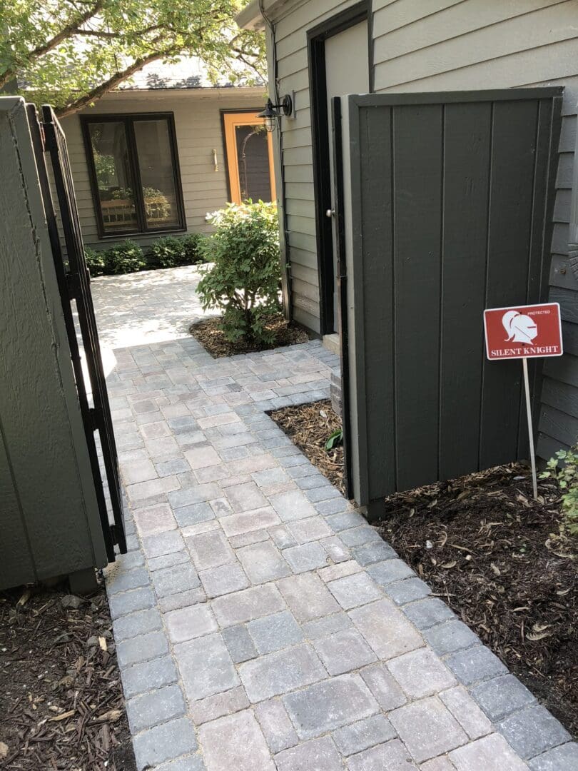 A walkway with a sign that says " open house ".