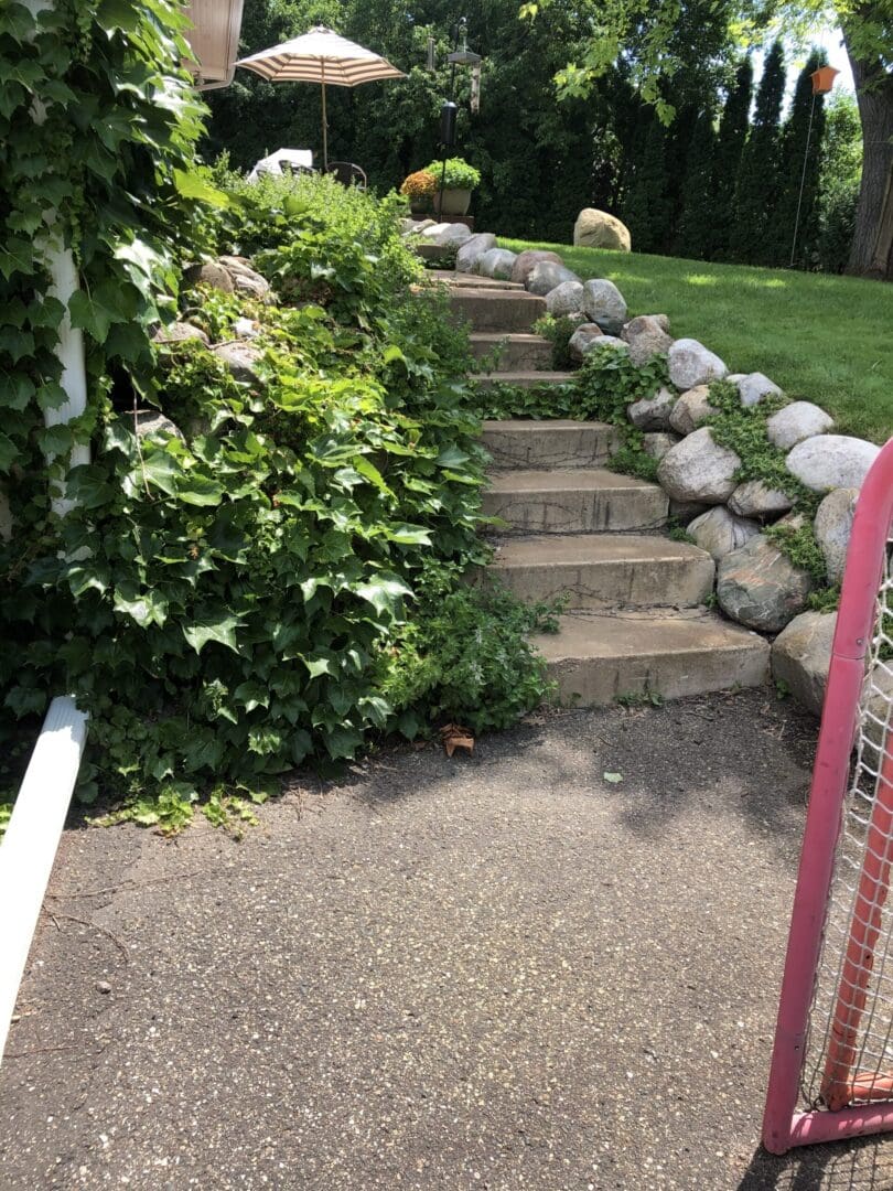 A walkway with steps leading to the top of stairs.