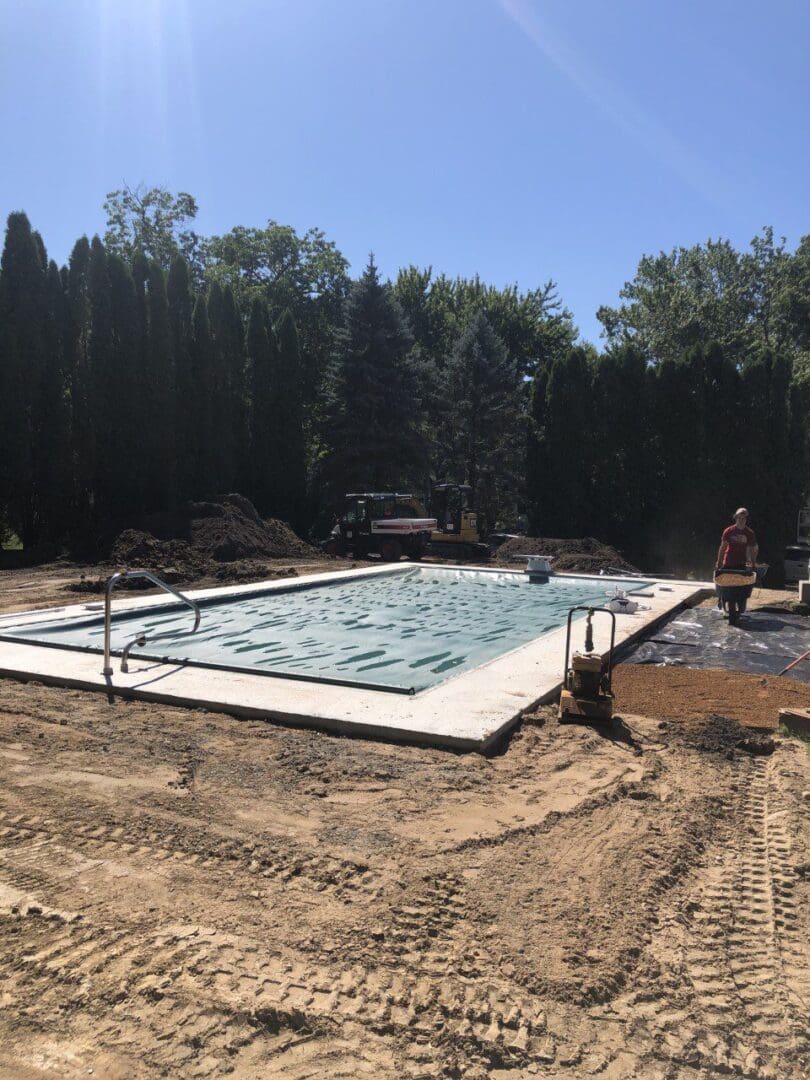 A pool is being built in the dirt.